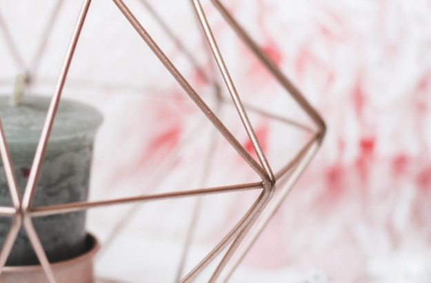 selective-focus-photography-of-candle-in-pink-ornate-holder